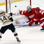 Boston Bruins center Carl Soderberg (34) scores against Detroit Red Wings goalie Petr Mrazek during the third period of an NHL hockey game in Detroit on Thursday, April 2, 2015. (AP Photo/Paul Sancya)