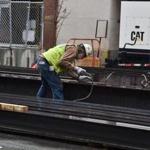 A worker tied a cable to a steel girder at a construction site in Washington, DC. 