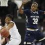 Connecticut guard Moriah Jefferson (4) and Notre Dame guard Jewell Loyd (32) chase a loose ball during the first half of the NCAA women's Final Four tournament college basketball championship game, Tuesday, April 7, 2015, in Tampa, Fla. (AP Photo/Brynn Anderson )