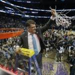 Geno Auriemma finishes taking down the net, the 10th time he?s done that as UConn women?s basketball coach.