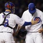 Jon Lester (right) had a tough time of things in his Cubs debut last week.