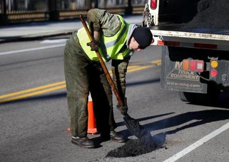 Scott Shea, a prolific paver in District 2, filled a pothole on Walk Hill Street in January.
