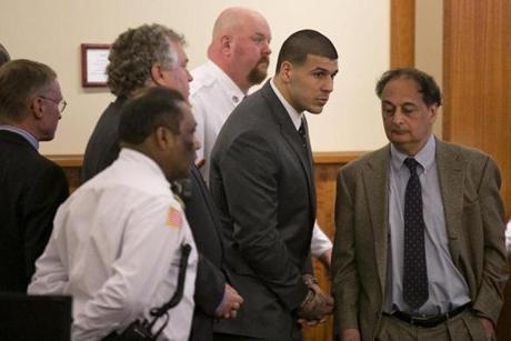 Aaron Hernandez listened as he was sentenced to life in prison for the murder of Odin Lloyd.
