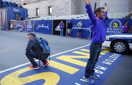Runner Farshid Parandian of Austin posed for a picture on the Marathon finish line. 

