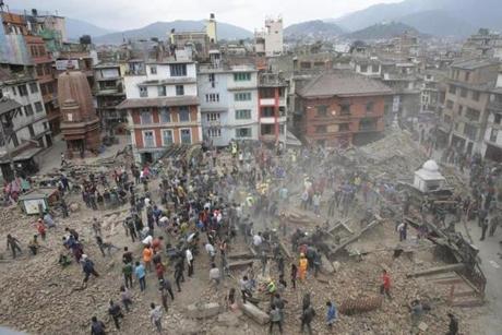 People searched for survivors under the rubble of collapsed buildings in Kathmandu Durbar Square. 
