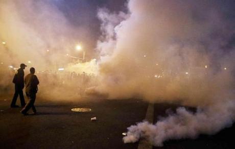 Police used smoke to disperse crowds in Baltimore after the 10 p.m. curfew. 
