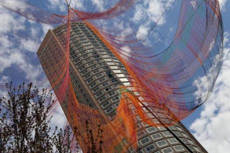 Janet Echelman?s floating sculpture being lifted over the Rose Fitzgerald Kennedy Greenway on Sunday morning.
