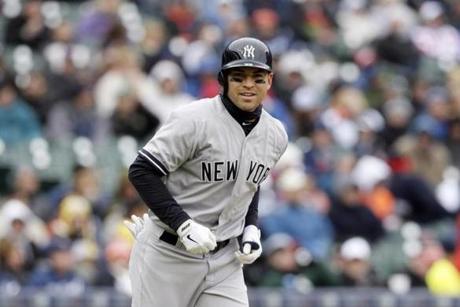 New York Yankees' Jacoby Ellsbury walks to first during the third inning of a baseball game against the Detroit Tigers, Thursday, April 23, 2015, in Detroit. (AP Photo/Carlos Osorio)

