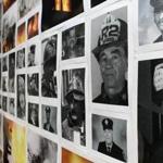  Pictures of firefighters who died of cancer hung on a wall at Boston Fire Department headquarters.