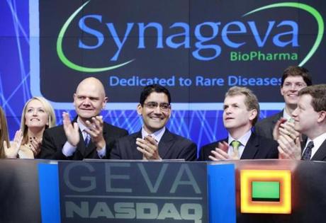 Sanj Patel, center, President and CEO of Synageva BioPharma Corp., attends the opening bell ceremony at Nasdaq with colleagues and guests, Thursday, Nov. 3, 2011 in New York. Synageva, based in Lexington, Mass., develops drugs for patients with life-threatening rare diseases. (Mark Lennihan/Associated Press)
