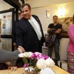 Stephanie Rhodes, left, shake hands with New Jersey Gov. Chris Christie, R-N.J., accompanied by his wife Mary Pat, as they arrive for a roundtable discussion at the Farrnum Center, Thursday, May 7, 2015, in Manchester, N.H. (AP Photo/Jim Cole)