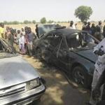 People gathered Friday at the site of a suicide bomb attack in Potiskum, Nigeria.