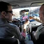 Lyft driver and Boston College law student Gabriel Gill-Austern (left) said passengers often ask him for legal guidance.