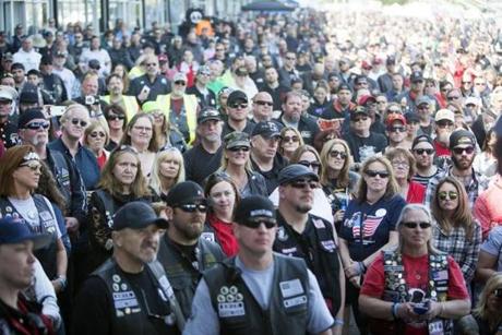 The riders at the Boston's Wounded Vet Run listen to the honorees stories. Kieran Kesner for The Boston Globe. 
