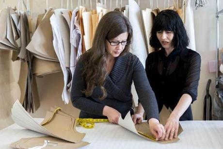 At Good Clothing Co. in Mashpee, founder Kathryn Hilderbrand (left) reviewed patterns with Aiste Zitnikaite.

