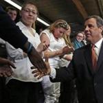 New Jersey Gov. Chris Christie shook hands with students after speaking at the University of New Hampshire in Manchester, N.H.,  on Tuesday.