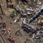 Investigators and first responders worked near the wreckage of an Amtrak passenger train that was carrying more than 200 passengers. 