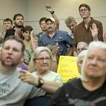 A multistate training exercise  by the Pentagon has sparked a tangled web of conspiracy theories, including a military invasion of Texas. Pictured: A public hearing in Bastrop, Texas, about the training exercise, called ?Jade Helm 15.?