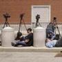 Members of the media waited outside the courthouse during closing statements Wednesday.  