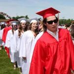 Young men and women wore different-colored gowns at East Longmeadow High School?s 2014 commencement.