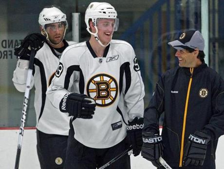 Don Sweeney (right, in 2011) played most of his NHL career in a Bruins uniform.
