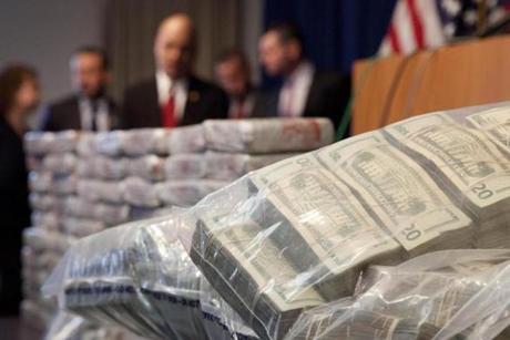 Sacks of money and 154 pounds of heroin, worth at least $50 million, were displayed at a Drug Enforcement Administration news conference,on Tuesday.
