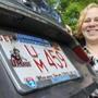 Angela Guillemette with her UMass Amhest license plate. 