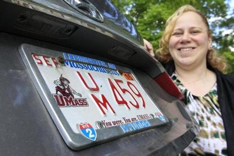 Angela Guillemette with her UMass Amhest license plate. 
