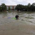 Joselyn Ramirez swam in a flooded school playground in Houston.