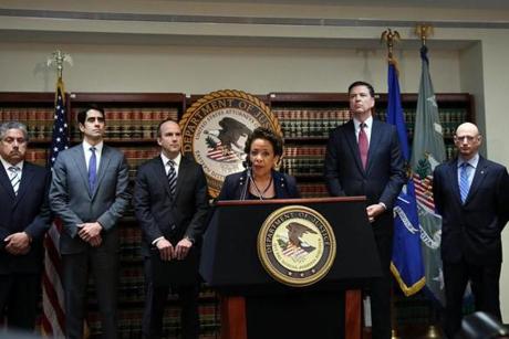 NEW YORK, NY - MAY 27: Attorney General Loretta Lynch speaks at a packed news conference at the U.S. Attorneys Office of the Eastern District of New York following the early morning arrest of world soccer figures, including officials of FIFA, for racketeering, bribery, money laundering and fraud on May 27, 2015 in New York City. The morning arrests took place at a hotel where FIFA members were attending a meeting for the world governing body of soccer (football) in Switzerland. The Justice Department unsealed a 47 count indictment early Wednesday charging 14 world soccer figures. (Photo by Spencer Platt/Getty Images)
