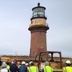 The brick lighthouse will travel over a specially made track of steel beams just 129 feet to its new perch over Vineyard Sound. 