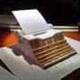 A paper model illustrated what the finished giant typewriter will look like. 