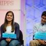 The remaining two spellers Vanya Shivashankar, 13, left, of Olathe, Kan., and Gokul Venkatachalam, 14, right, of St. Louis, sit on stage during the finals of the Scripps National Spelling Bee, Thursday, May 28, 2015, in Oxon Hill, Md. (AP Photo/Andrew Harnik)