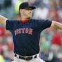 Boston Red Sox starting pitcher Steven Wright (35) throws during the first inning of a baseball game against the Texas Rangers, Friday, May 29, 2015, in Arlington, Texas. (AP Photo/Brandon Wade)