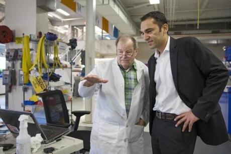 Udit Batra (right), chief executive of EMD Millipore, spoke with George Oulundsen while touring the firm?s bio-manufacturing sciences and training center.
