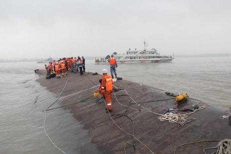 Rescuers searched for survivors from the capsized ship in the Yangtze River.
