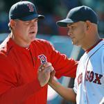 Manager John Farrell (left) may have something special on his hands in young lefty Eduardo Rodriguez. 