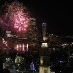 Boston, MA - 12-31-14 - Fireworks burst over Boston Common during First Night festivities. Park St Church in forground. (Bill Greene / Globe staff) 