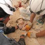 Rescue workers removed a baby?s body from the rubble of a house after a reported barrel-bomb attack in Aleppo, Syria. 