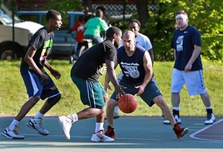 Officer Manny Canuto played defense during a game on Humboldt Avenue.
