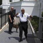 Secret Service police move members of the media outside the briefing room as they evacuate parts of the White House in Washington, Tuesday, June 9, 2015. (AP Photo/Evan Vucci)