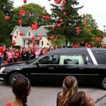 In Mansfield, red balloons were released as Shane Farrell?s hearse passed by on Tuesday. 