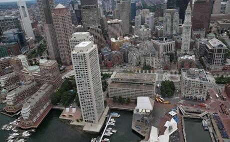 Plans for the Boston Harbor Garage (the low building to the right of the two towers) have raised concerns about height, density, and waterfront access. 
