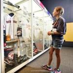 Red Sox fan Katelyn Abel, 10, of Jamesville-Wellwood Middle School admires Red Sox memorabilia in the Baseball Hall of Fame on Friday, June 12, 2015 in Cooperstown NY. (Nancy L. Ford for The Boston Globe)