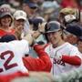 Boston Red Sox's Brock Holt celebrates in the dugout after hitting a solo homer in the seventh inning of a baseball game against the Atlanta Braves at Fenway Park Tuesday, June 16, 2015, in Boston. (AP Photo/Elise Amendola)