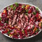 Grilled steak and radicchio salad with plums and red wine vinaigrette.