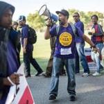 06/17/2015 EAST BOSTON, MA Office cleanerJose Perez (cq), of South Boston, joined fellow ReadyJet Inc. and G2 Secure employees on a picket line after going on strike outside Airport Station near Logan Airport. (Aram Boghosian for The Boston Globe) 