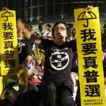 Prodemocracy protesters held placards that read: ?I want genuine universal suffrage? during a rally Wednesday outside the Legislative Council in Hong Kong.