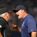 Red Sox manager John Farrell (right) argued a call with first base umpire Larry Vanover in the seventh inning and was ejected. 