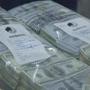 Police seized more than $1.5 million in cash during the investigation.